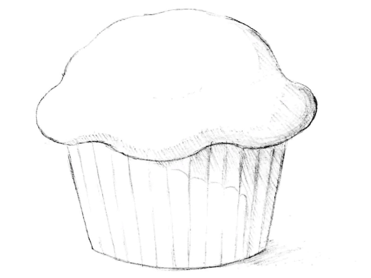 Completed muffin drawing with realistic shading and a textured paper wrapper.